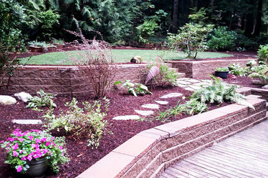 Photo of a backyard retaining wall landscape in Seattle.