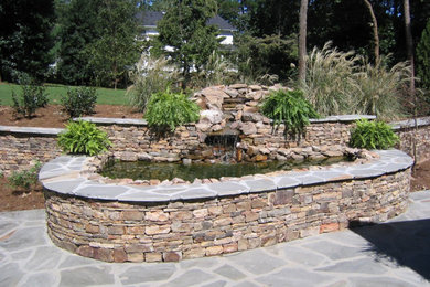 Design ideas for a large farmhouse full sun backyard stone landscaping in Atlanta for summer.