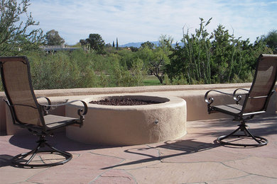 Design ideas for a mid-sized full sun backyard concrete paver landscaping in Phoenix with a fire pit for summer.