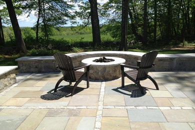 Design ideas for a classic back patio in Boston with a fire feature.