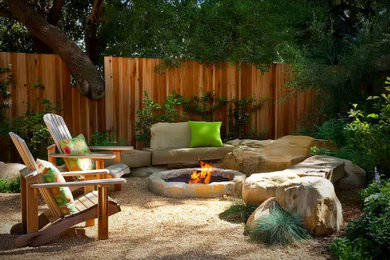 Design ideas for a small rustic drought-tolerant and partial sun backyard decomposed granite landscaping in Austin with a fire pit for fall.