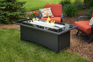 Inspiration for a small traditional full sun backyard mulch formal garden in Orange County with a fire pit for spring.