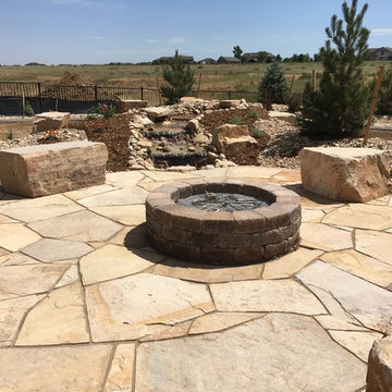 Flagstone Patio, Seat Boulders, Water Feature and Fire Pit; Windsor, CO 2016