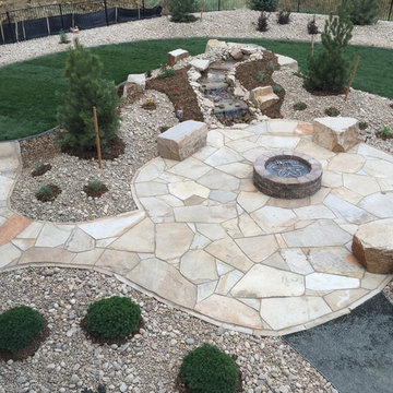 Flagstone Patio, Seat Boulders, Water Feature and Fire Pit; Windsor, CO 2016