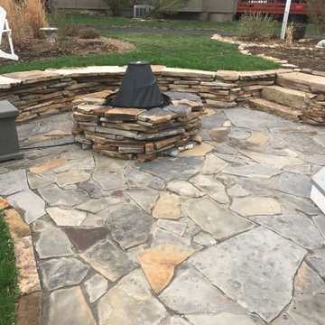 Flagstone Patio w/Natural stone seating ledge and lighted under mount.