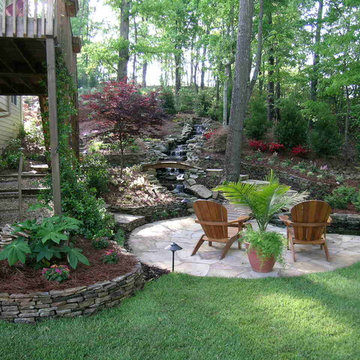Flagstone patio with terraced steps and waterfall