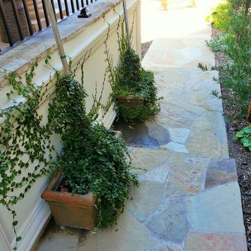 Flagstone walkway with container plants