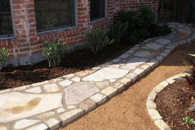 Photo of a transitional drought-tolerant side yard stone garden path in Dallas.