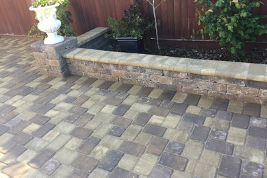 Photo of a medium sized classic back garden in San Francisco with a retaining wall and brick paving.