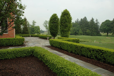 Formal Bluestone Terrace with Boxwood Hedge