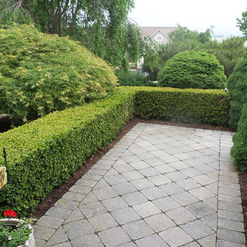 Formal entry with walkway and boxwood hedge