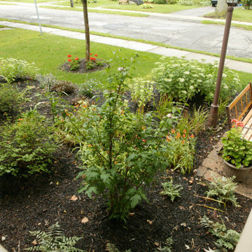 Formal Gardens in Front and Pondless Stream in Backyard