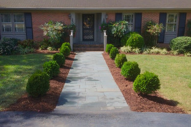 This is an example of a contemporary front yard stone landscaping in Richmond.