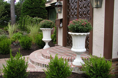 Design ideas for a mid-sized traditional partial sun front yard brick formal garden in Boston.