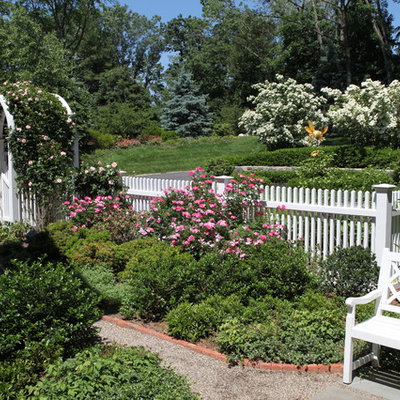 Photo of a large traditional full sun backyard stone formal garden in New York.
