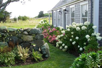 Inspiration for a farmhouse partial sun front yard garden path in Boston for summer.
