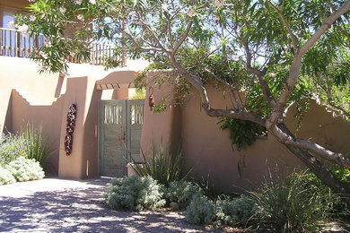Photo of a large southwestern partial sun stone landscaping in Albuquerque.
