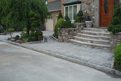 Photo of a large transitional partial sun stone garden path in New York.