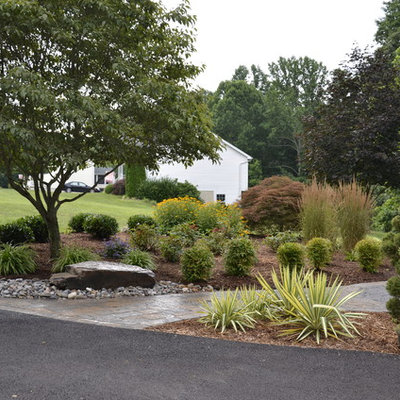 Inspiration for a large traditional partial sun backyard stone garden path in DC Metro for spring.