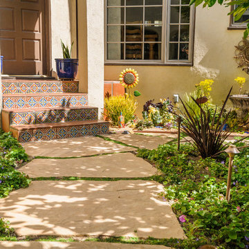 Front yard entrance flagstone path Spanish detail tiles on steps.