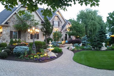 Inspiration for a large traditional partial sun front yard brick formal garden in Philadelphia.
