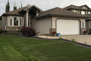 Photo of a mid-sized traditional landscaping in Edmonton.