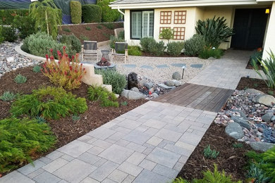 Design ideas for a mid-sized mediterranean drought-tolerant and full sun front yard concrete paver garden path in San Diego.