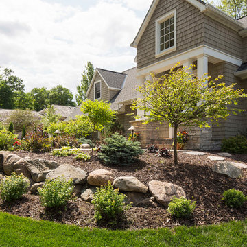 Front Yard With Boulder Wall and Shrub Bed