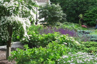 Inspiration for a mid-sized traditional full sun front yard garden path in New York.