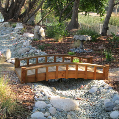 This is an example of a large traditional drought-tolerant and partial sun front yard gravel garden path in Orange County.