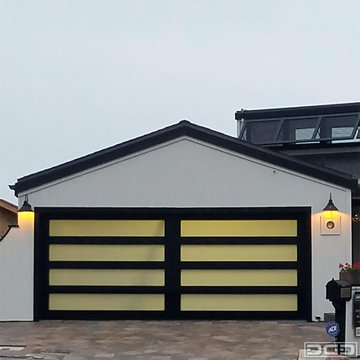 Fullview Garage Door With a Black Frame and White-Laminate Glass Panes for a Lag