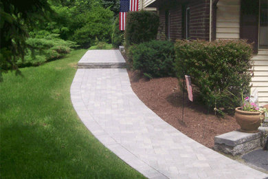 This is an example of a traditional side yard brick garden path in New York.