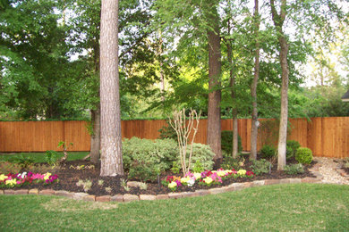This is an example of a large full sun backyard brick landscaping in Houston.