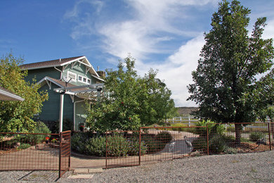 Photo of a mid-sized farmhouse front yard driveway in Denver.