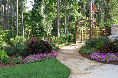 Inspiration for a large mediterranean garden in Atlanta with a garden path and natural stone paving.