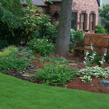 Garden bench with shade tolerant plantings