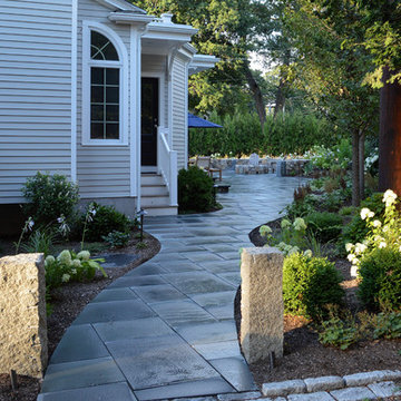 Garden bluestone patio entry granite posts.