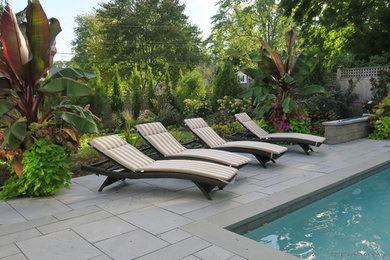 Design ideas for a traditional full sun backyard concrete paver water fountain landscape in New York for summer.