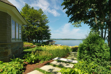 Design ideas for an expansive contemporary back full sun garden for summer in Burlington with a garden path and concrete paving.