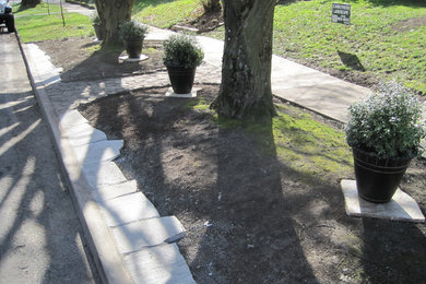 Photo of an eclectic shade stone garden path in Portland.