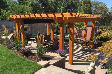 Photo of a traditional full sun backyard brick landscaping in Salt Lake City for summer.