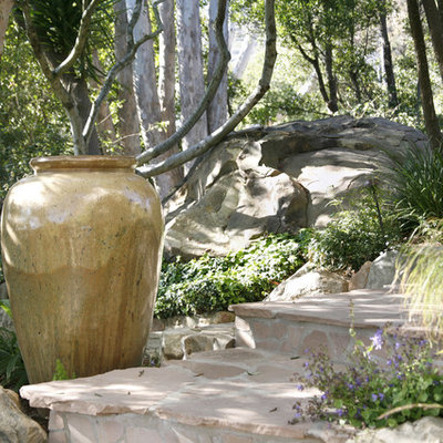 Inspiration for a mid-sized eclectic backyard stone landscaping in Santa Barbara.