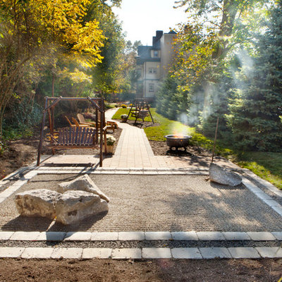 Inspiration for a contemporary backyard landscaping in New York with a fire pit.