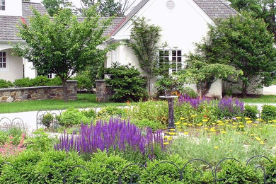 This is an example of a large contemporary full sun front yard formal garden in Philadelphia.