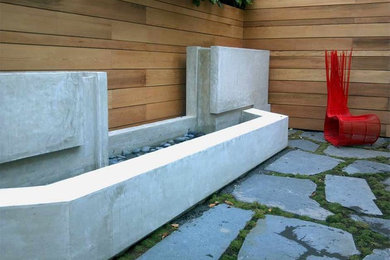 Inspiration for a small contemporary partial sun backyard concrete paver water fountain landscape in San Francisco.