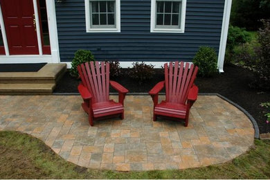 Inspiration for a large backyard stone patio remodel in Bridgeport