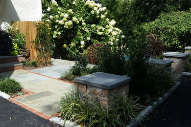 This is an example of a mid-sized traditional full sun backyard concrete paver garden path in Philadelphia.