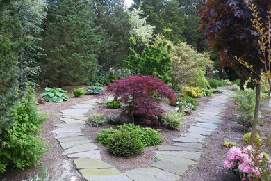 Medium sized classic courtyard formal partial sun garden in Boston with a garden path and natural stone paving.