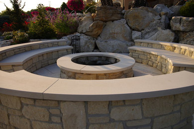 Design ideas for a large craftsman full sun backyard stone formal garden in Chicago with a fire pit for summer.
