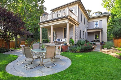 Design ideas for a large contemporary back formal full sun garden in Boston with natural stone paving.